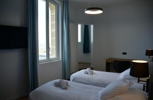 Asnelles Resort | Les Tourelles - Chalets & Chambres en Bord de Mer