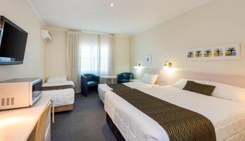 Standard Room with One Queen Bed and Two Single Beds